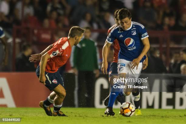 Nicolas Domingo of Independiente and Jair Palacios Silva of Millonarios battle for the ball during the Copa Conmebol Libertadores match between...