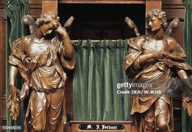 Wooden statues of angels, confessional box in the Cathedral of St Michael and St Gudula, 13th-17th century, Brussels, Belgium.