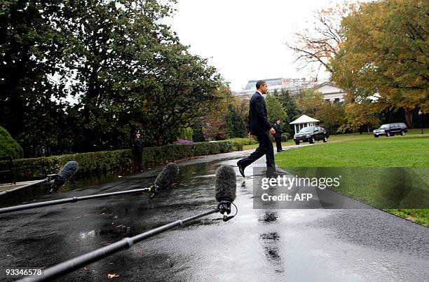 President Barack Obama departs the White House on a rainy morning for a day trip to Philadelphia, Pennsylvania and Newark, New Jersey on the South...