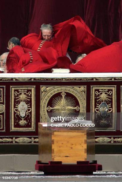 The wind lifts the cap of Italian Cardinal Carlo Maria Martini during the funeral of Pope John Paul II in St Peter's Square at the Vatican City 08...