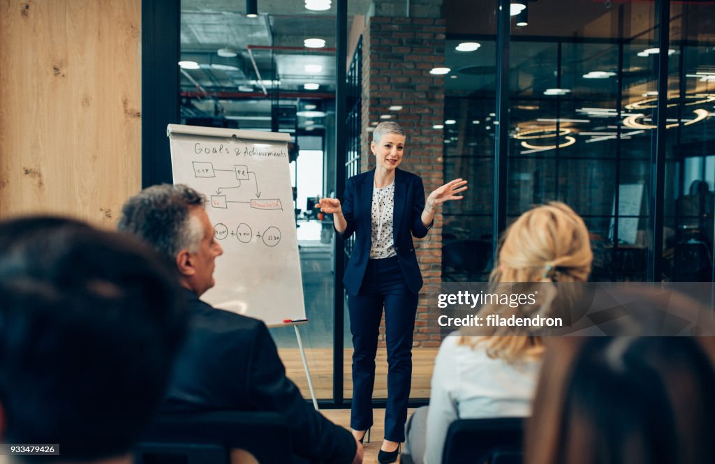 Businesswoman Speaking in front of Audience