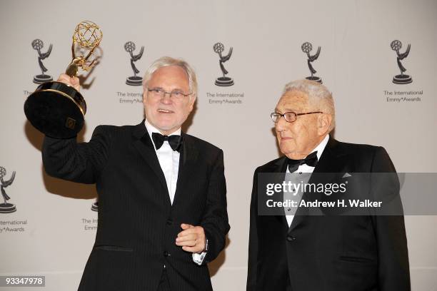 Prof. Markus Schachter and Dr. Henry Kissinger attend the 37th International Emmy Awards gala press room at the New York Hilton and Towers on...