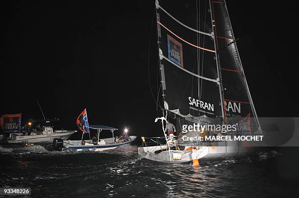 French skippers Marc Guillemot and Charles Caudrelier , aboard the monohull "Safran", arrive in Puerto Limon harbour on November 24, 2009 after...
