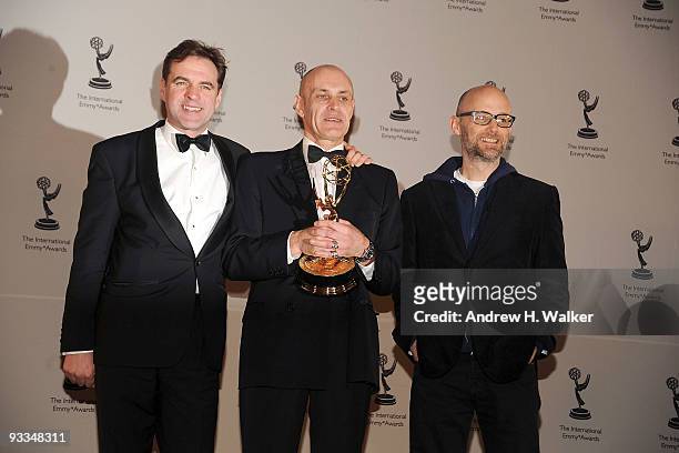 Adrian Pennink, Prof. Niall Ferguson and Moby attend the 37th International Emmy Awards gala press room at the New York Hilton and Towers on November...