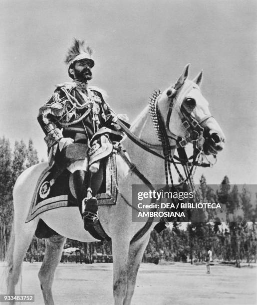The Emperor of Ethiopia Haile Selassie watching a march-past of his troops, photograph from The Illustrated London News, July 6, 1935.