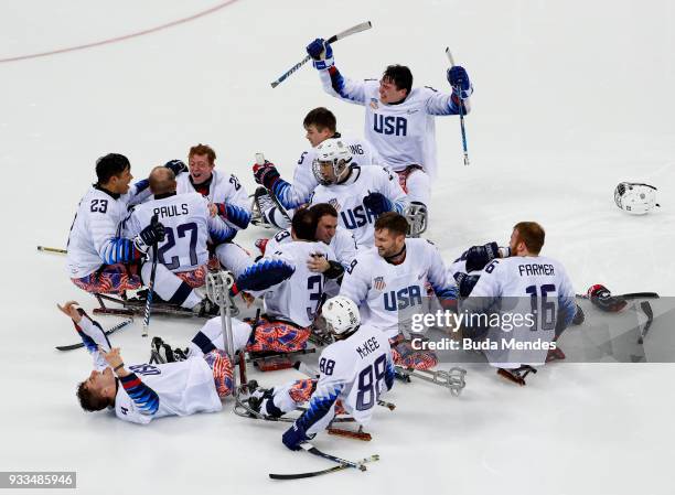 Team of the United States celebrates the gold medal after winning in the Ice Hockey gold medal game between United States and Canada during day nine...