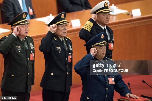 Xu Qiliang , vice chairman of the Central Military Commission of the People's Republic of China, swears an oath with members of the Central Military...