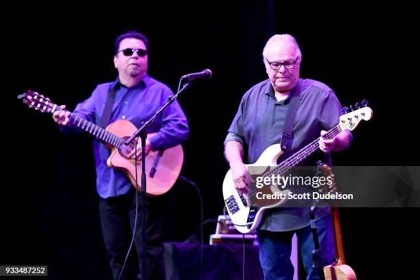 Musicians Cesar Rosas and Conrad Lozano of the band Los Lobos perform onstage at Thousand Oaks Civic Arts Plaza on March 17, 2018 in Thousand Oaks,...