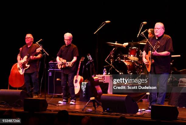 Musicians Conrad Lozano, Enrique Gonzalez, Louie Perez and David Hidalgo of the band Los Lobos perform onstage at Thousand Oaks Civic Arts Plaza on...