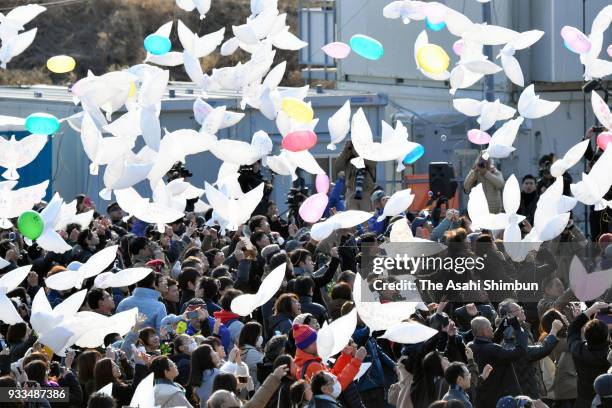 People release dove-shaped balloons on the 7th anniversary of the Great East Japan Earthquake on March 11, 2018 in Natori, Miyagi, Japan. The death...