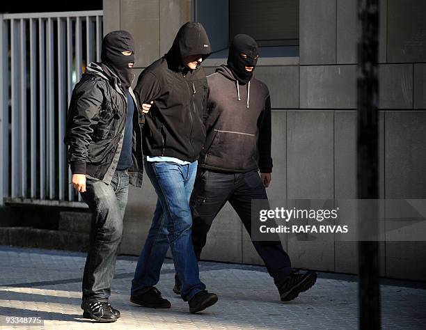 An unidentified person , suspected of being a member of Segi, an outlawed youth group believed to have ties to the armed Basque separatist group ETA,...