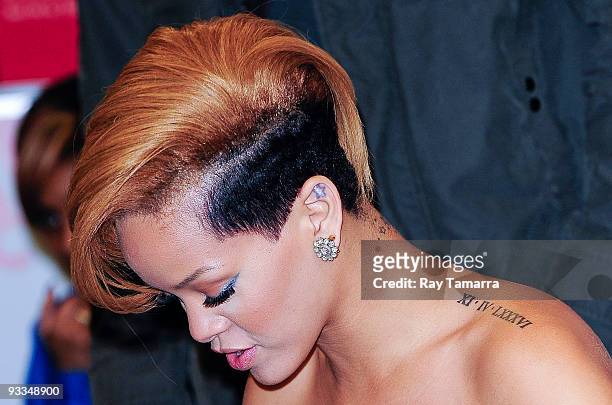 Singer Rihanna poses for photos at Best Buy on November 23, 2009 in New York City.