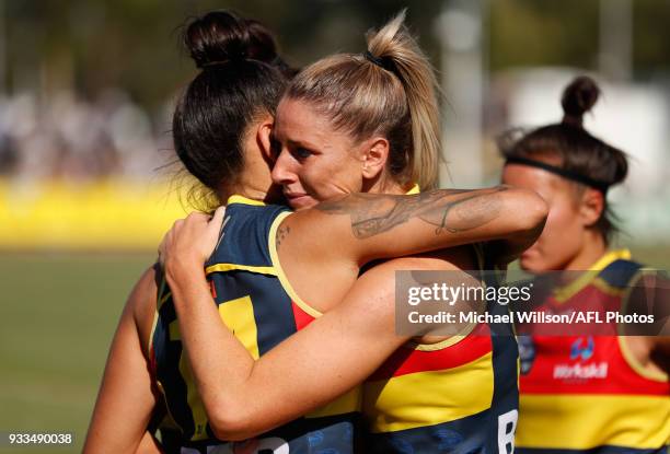 Stevie-Lee Thompson and Deni Varnhagen of the Crows look dejected after a loss during the 2018 AFLW Round 07 match between the Collingwood Magpies...