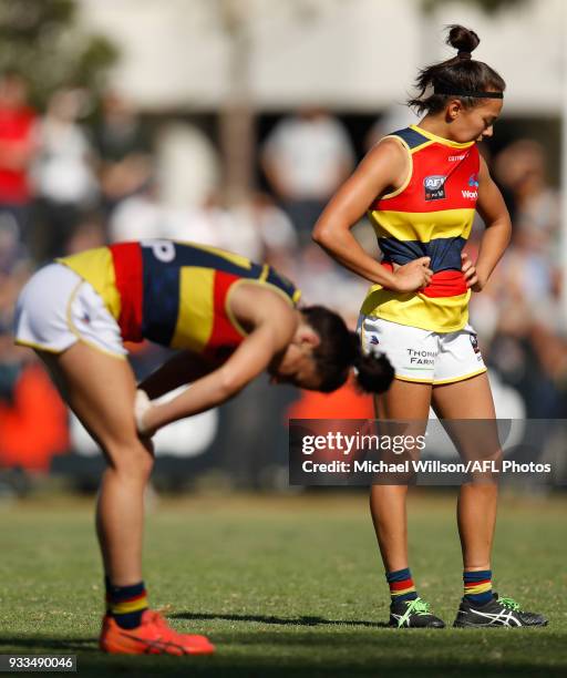 Jessica Sedunary and Justine Mules of the Crows look dejected after a loss during the 2018 AFLW Round 07 match between the Collingwood Magpies and...