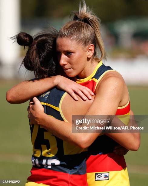 Justine Mules and Deni Varnhagen of the Crows look dejected after a loss during the 2018 AFLW Round 07 match between the Collingwood Magpies and the...