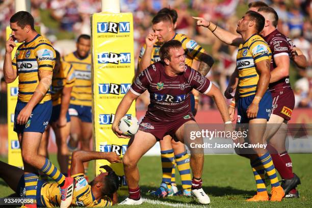 Jake Trbojevic of the Sea Eagles celebrates scoring a try during the round two NRL match between the Manly Sea Eagles and the Parramatta Eels at...