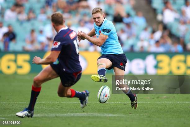 Bryce Hegarty of the Waratahs kicks ahead during the round five Super Rugby match between the Waratahs and the Rebels at Allianz Stadium on March 18,...