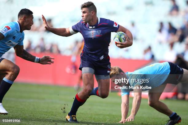 Tom English of the Rebels runs the ball during the round five Super Rugby match between the Waratahs and the Rebels at Allianz Stadium on March 18,...
