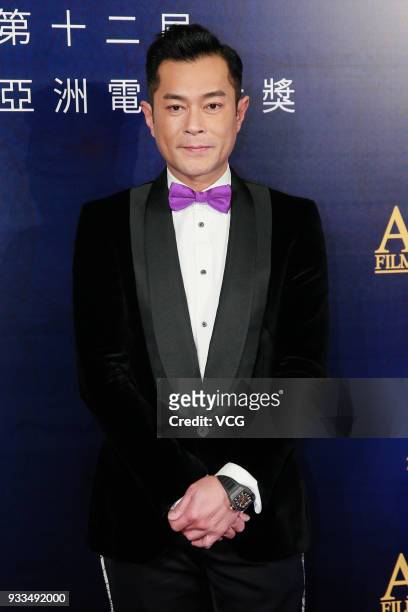 Actor Louis Koo Tin-lok poses on the red carpet of the 12th Asian Film Awards at the Venetian Hotel on March 17, 2018 in Macao, China.