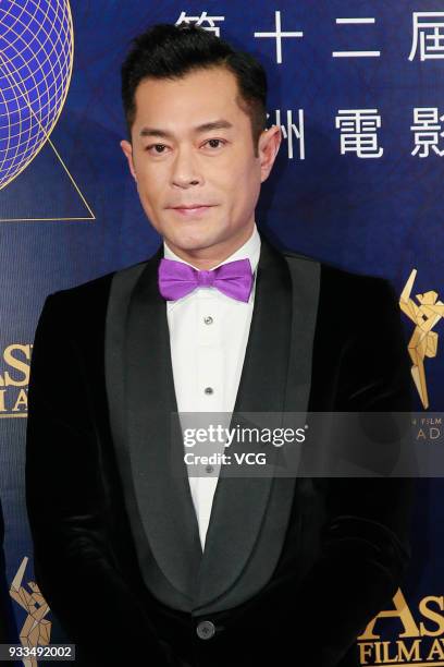 Actor Louis Koo Tin-lok poses on the red carpet of the 12th Asian Film Awards at the Venetian Hotel on March 17, 2018 in Macao, China.