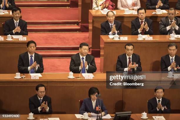 Li Zhanshu, member of the Communist Party of China's Politburo Standing Committee, second row from left, Xi Jinping, China's president, Li Keqiang,...