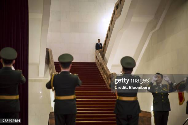 Members of the People's Liberation Army band rehearse ahead of a session at the first session of the 13th National People's Congress at the Great...