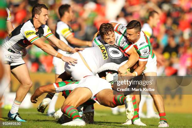 Sam Burgess of the Rabbitohs tackles Reagan Campbell-Gillard of the Panthers during the round two NRL match between the Penrith Panthers and the...