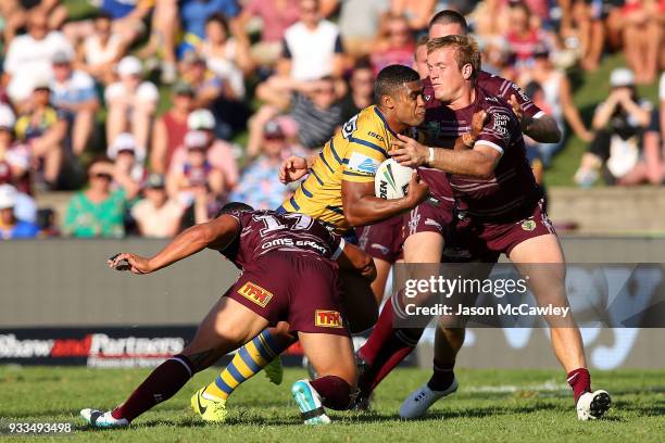 Michael Jennings of the Eels is tackled by Jake Trbojevic of the Sea Eagles during the round two NRL match between the Manly Sea Eagles and the...