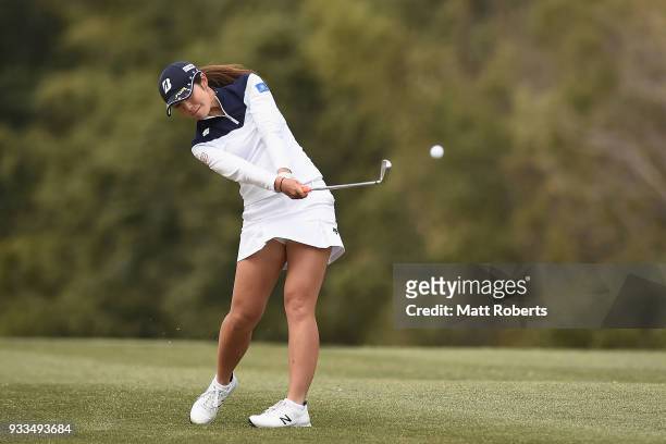 Ayaka Watanabe of Japan plays her second shot on the 18th hole during the final round of the T-Point Ladies Golf Tournament at the Ibaraki Kokusai...