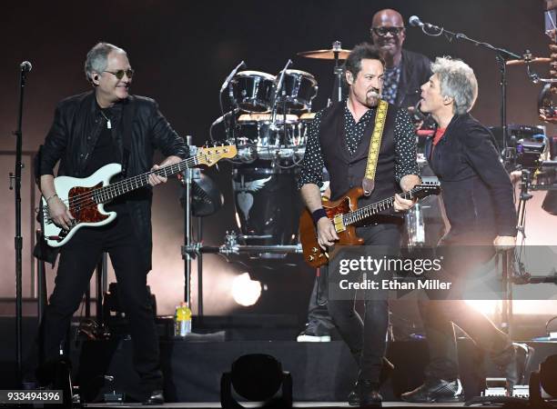 Bassist Hugh McDonald of Bon Jovi, guitarist/producer John Shanks, percussionist Everett Bradley and frontman Jon Bon Jovi of Bon Jovi perform during...