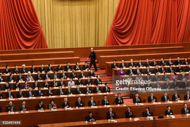 Newly appointed Procurator-General of China's Supreme People's Procuratorate Zhang Jun walks before swearing an oath during the sixth plenary session...