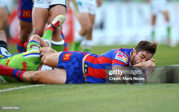 Aidan Guerra of the Knights scores a try during the round two NRL match between the Canberra Raiders and the Newcastle Knights at GIO Stadium on...