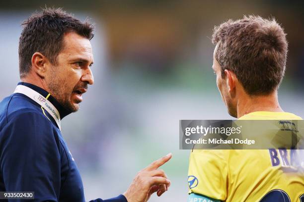 Mariners head coach Paul Okon speaks to Wout Brama of the Mariners after their defeat during the round 23 A-League match between the Melbourne...