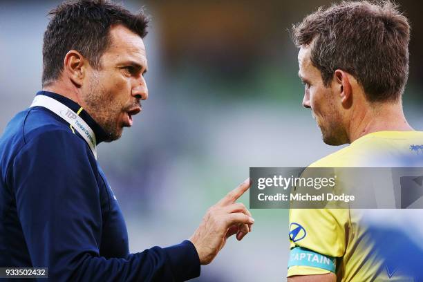 Mariners head coach Paul Okon speaks to Wout Brama of the Mariners after their defeat during the round 23 A-League match between the Melbourne...