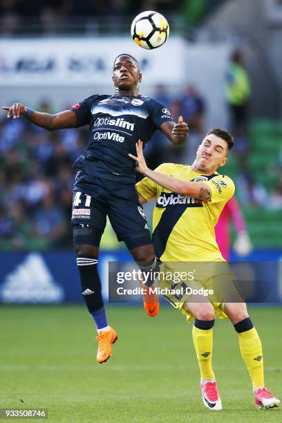 Leroy George of the Victory and Storm Roux of the Mariners compete for the ball during the round 23 A-League match between the Melbourne Victory and...