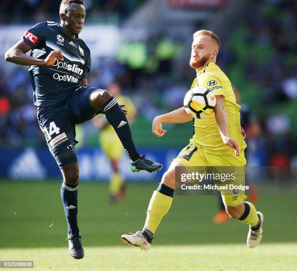 Thomas Deng of the Victory tackles Connor Pain of the Mariners during the round 23 A-League match between the Melbourne Victory and the Central Coast...