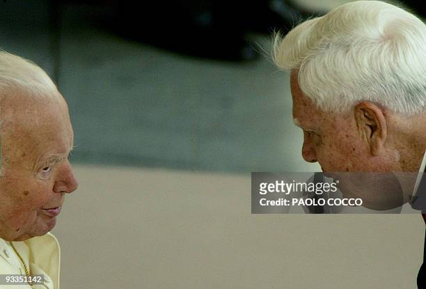 Cardinal Bernard Law , who recently resigned as Archbishop of Boston, talks with Pope John Paul II at the end of the weekly's general audience in St...