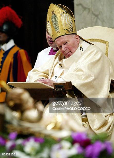 Pope John Paul II watches a statue of Jesus at St. Peter's Basilica in the Vatican during the celebration of a mass marking World Peace Day 01...