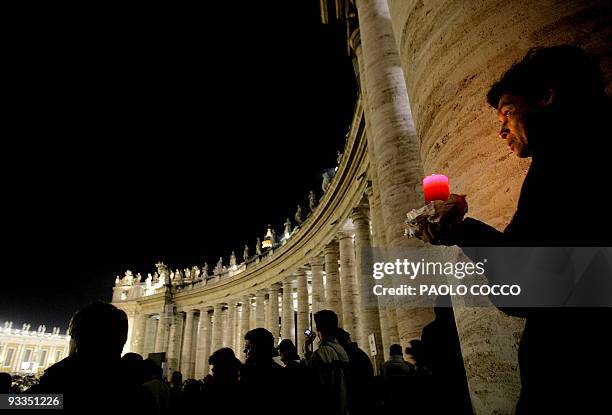 Faithfuls pray at St Peter's Square in the Vatican City, 02 April 2005, after the death of Pope John Paul II. "The Holy Father died this evening at...