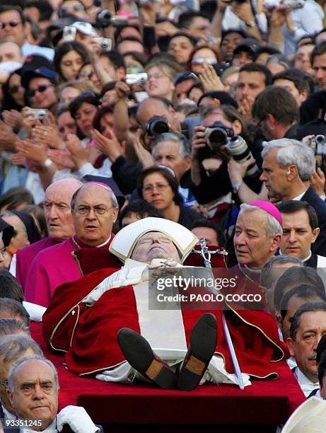 The Pope's body is carried to be transfered from the Apostolic Palace to St Peter's Basilica, 04 April 2005 at the Vatican City. After the solemn...