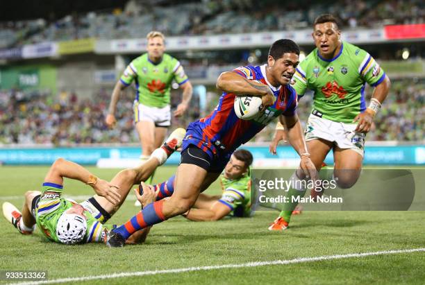 Sione Mata'utia of the Knights heads to the try line to score during the round two NRL match between the Canberra Raiders and the Newcastle Knights...