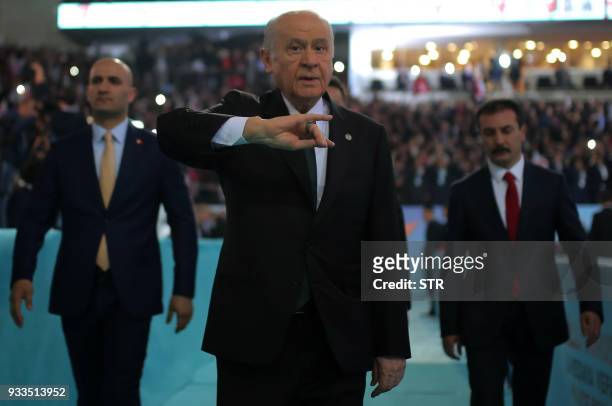 Turkey's right-wing Nationalist Movement Party's Leader, Devlet Bahceli greets the crowd during the party's 12th Ordinary Grand Congress in Ankara on...