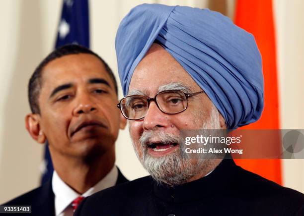 Indian Prime Minister Manmohan Singh , accompanied by U.S. President Barack Obama, speaks during a state arrival ceremony in the East Room of the...