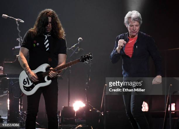 Guitarist Phil X and frontman Jon Bon Jovi of Bon Jovi perform during a stop of the band's This House is Not for Sale Tour at T-Mobile Arena on March...