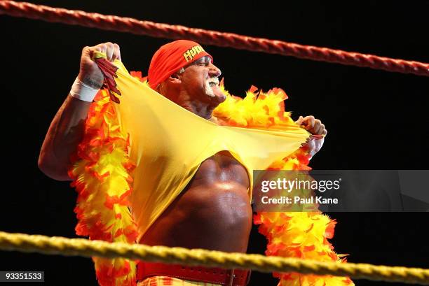 Hulk Hogan rips his shirt prior to the bout against Ric Flair during his Hulkamania Tour at the Burswood Dome on November 24, 2009 in Perth,...