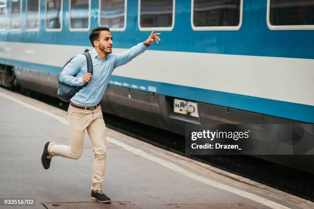 businessman almost missed the train - top priority stock pictures, royalty-free photos & images