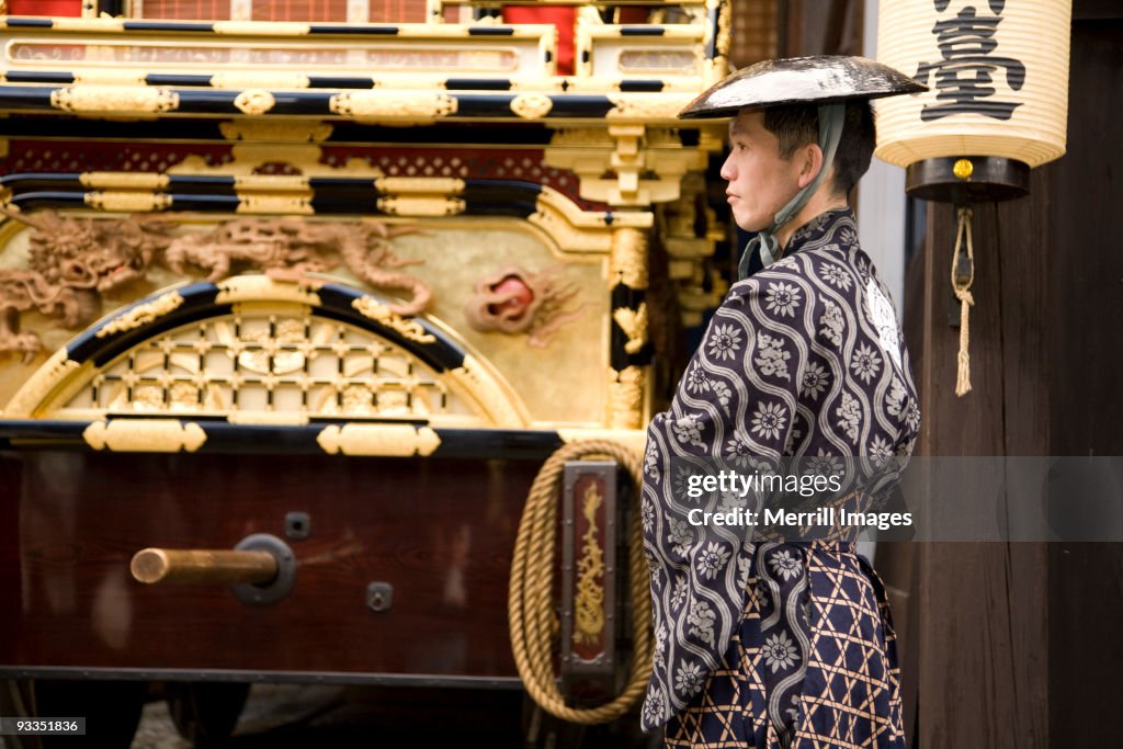 Man waiting to pull elaborate festival float