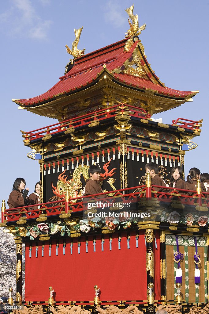 Children on elaborate festival float