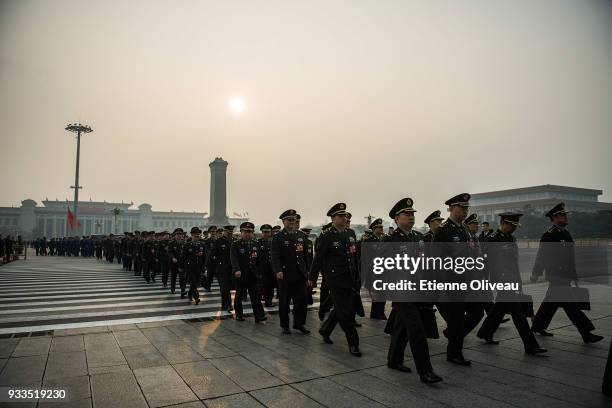 Military delegates arrive to attend the sixth plenary session of the National People's Congress at the Great Hall of the People on March 18, 2018 in...