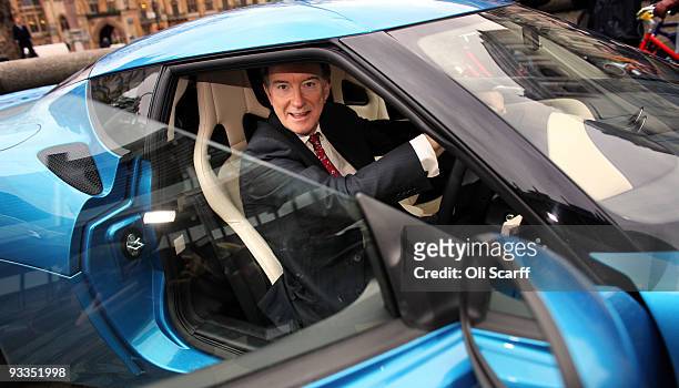 Lord Mandelson the Secretary of State for Business Innovation and Skills examines a new Lotus Evora car outside the Queen Elizabeth II Conference...
